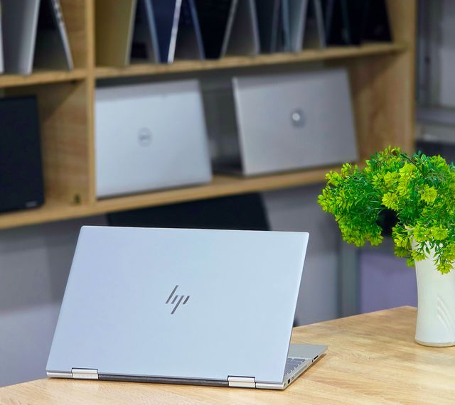 image showing laptops displayed on shelves at a computer store